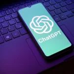 The ChatGPT logo appears on a smartphone screen