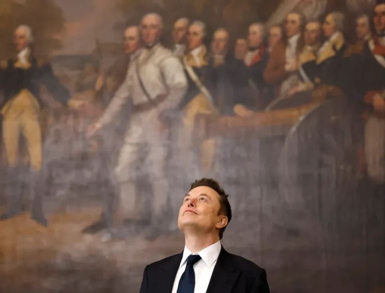 a photo of Elon Musk looking up at the ceiling while standing in front of a historical painting