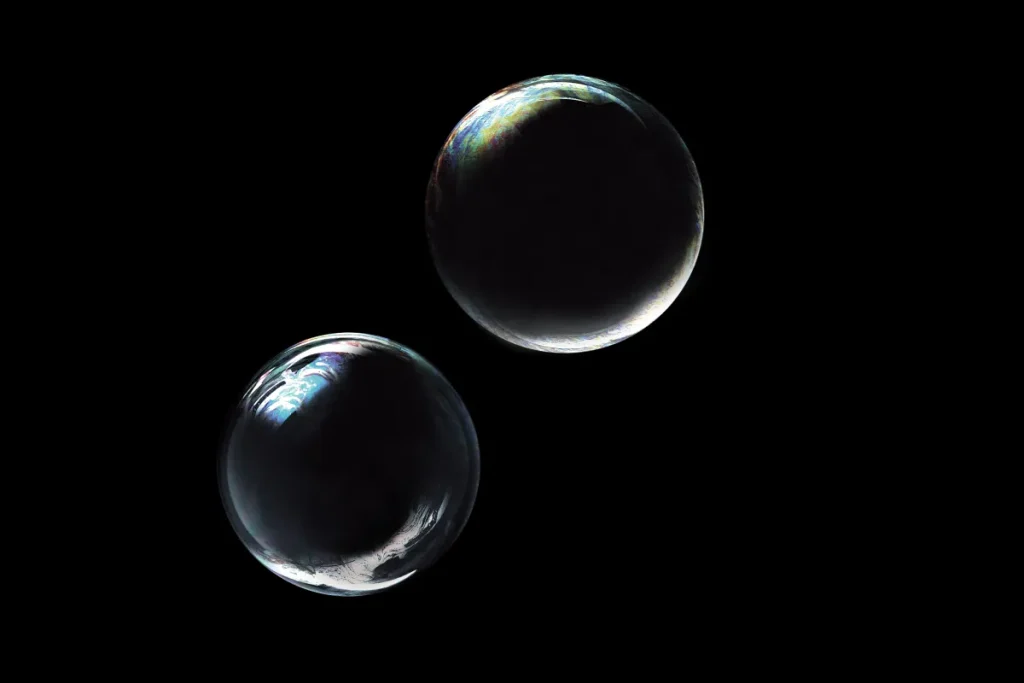 two bubbles floating against black backdrop