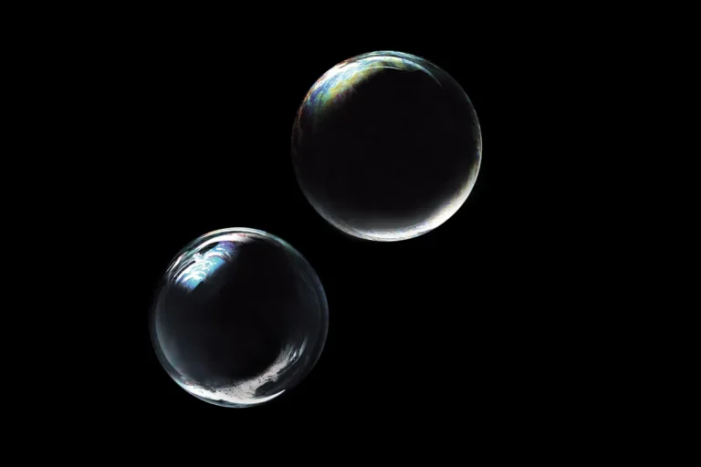 two bubbles floating against black backdrop