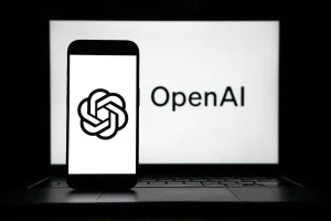 the logos of Open AI displayed on both computer and smart phone screen