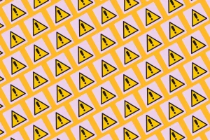 yellow warning symbols with exclamation points on a patterned background