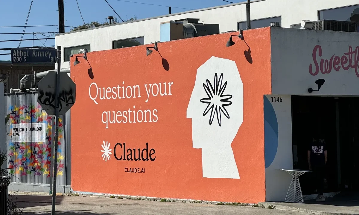 Claude ad on side of building