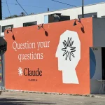 Claude ad on side of building