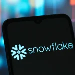 In this photo illustration, the Snowflake logo is seen displayed on a smartphone screen.
