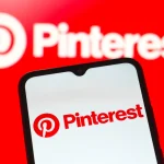 In this photo illustration, the Pinterest logo is seen displayed on a smartphone screen.