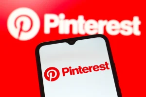 In this photo illustration, the Pinterest logo is seen displayed on a smartphone screen.