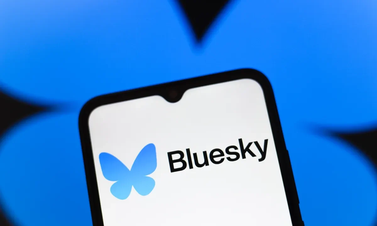 Bluesky logo appears on the screen of a smartphone