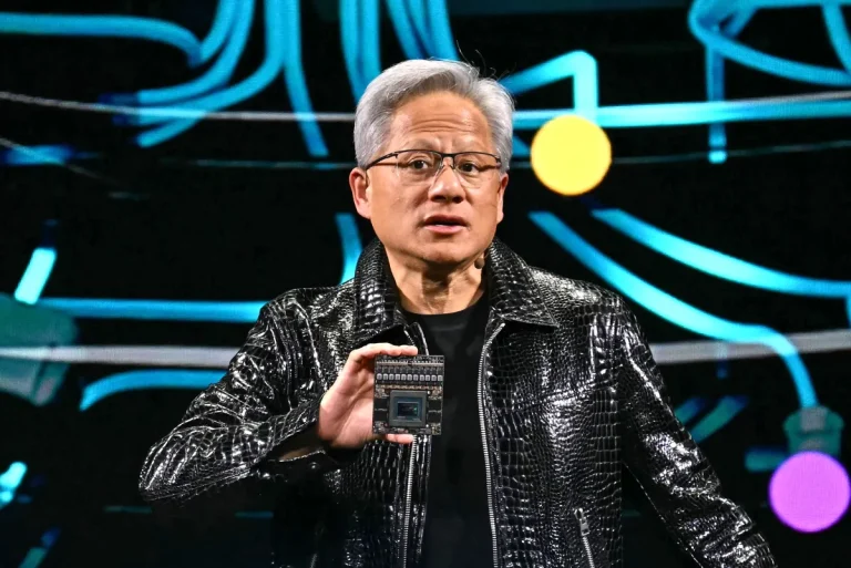 Jensen Huang holds up chip at CES 2025