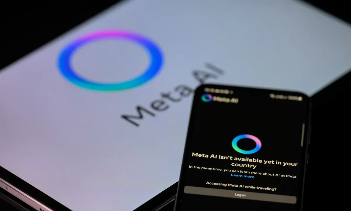 The Meta AI app is displayed on a mobile phone with the Meta AI logo visible on a tablet in this photo illustration