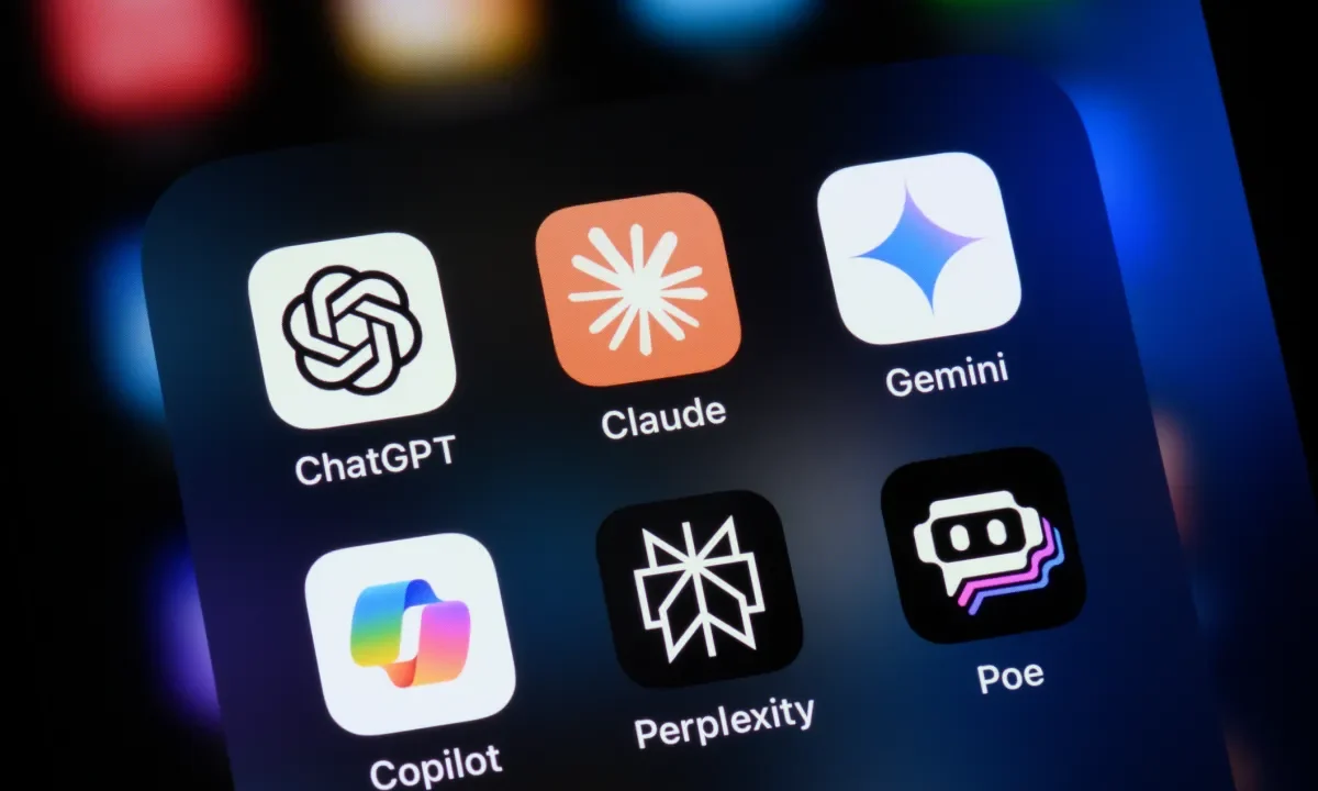 Popular AI virtual assistant apps on an Apple iPhone: ChatGPT, Claude, Gemini, Copilot, Perplexity, and Poe.