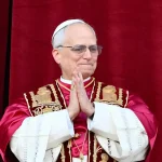 Pope Leo XIV, Robert Prevost arrives on the main central loggia balcony of the St Peter's Basilica for the first time.