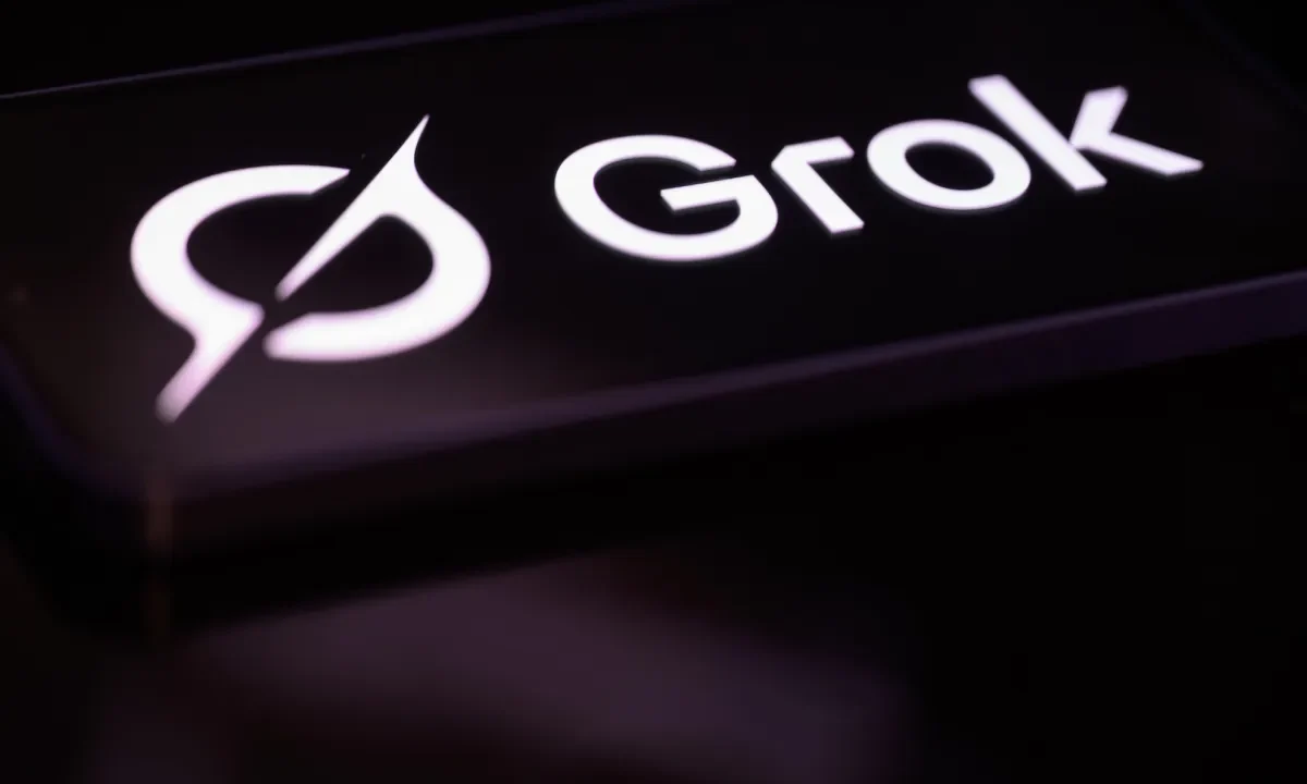 The Grok logo is displayed on a mobile phone screen