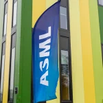 A banner flag with the ASML logo outside the Brainport Industries Campus, which houses the ASML Academy, in Eindhoven, Netherlands.
