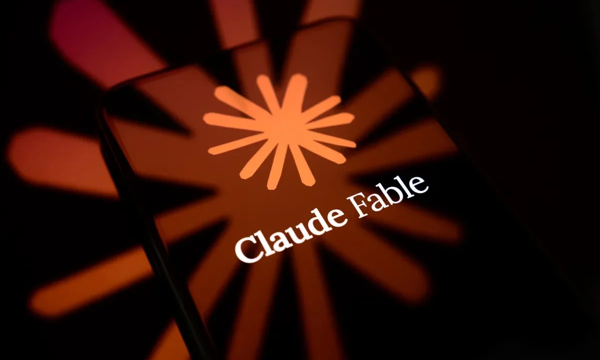 The Claude Fable logo is displayed on the screen of a smartphone placed on a reflective surface onto which the company's icon is projected.