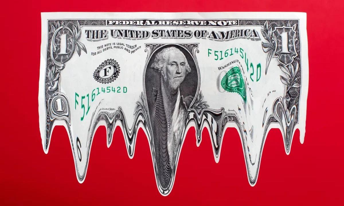 US $1 dollar bill in mid-air, melting