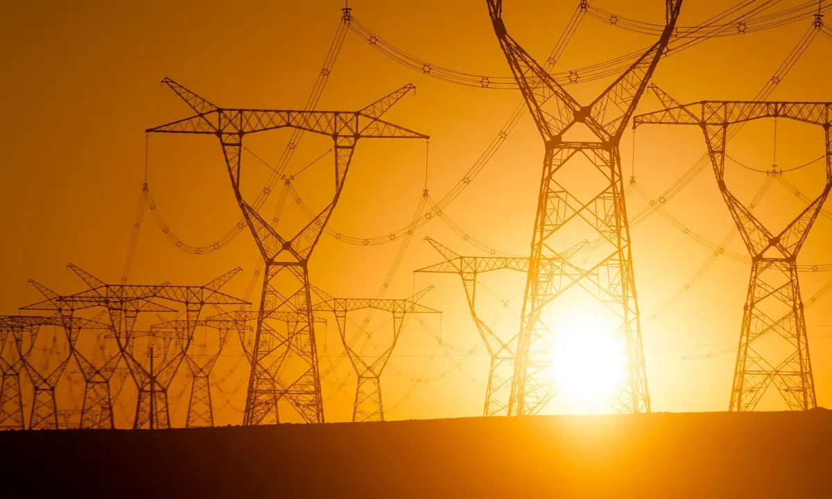 Silhouetted electricity pylon grid