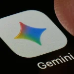 A macro close-up photograph shows the Google Gemini AI app icon