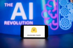 In this photo illustration, the Hugging Face logo seen displayed on a mobile phone screen with the AI (artificial intelligence) revolution symbol in the background.