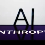 AI sign displayed on a screen and Anthropic logo displayed on a phone screen are seen in this illustration photo.