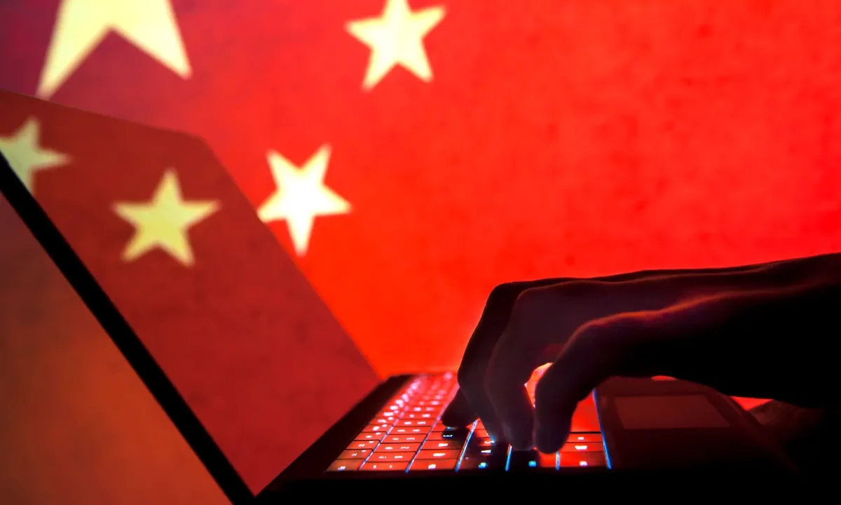 Cybercriminal, hacker China flag background.