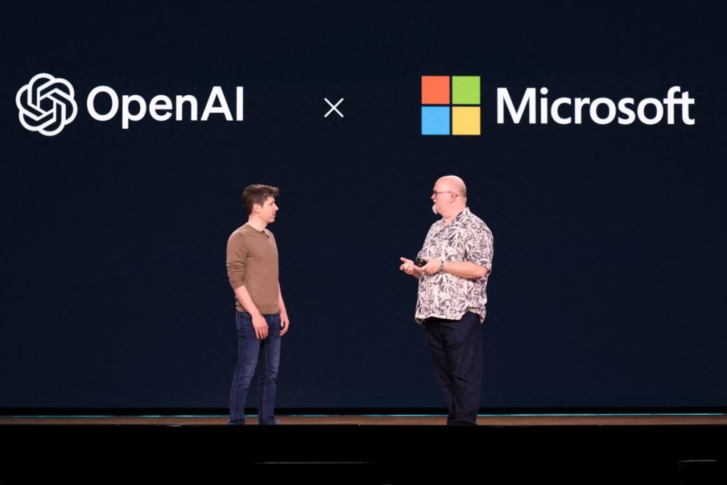 OpenAI CEO Sam Altman (L) speaks with Microsoft Chief Technology Officer and Executive VP of Artificial Intelligence Kevin Scott