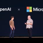 OpenAI CEO Sam Altman (L) speaks with Microsoft Chief Technology Officer and Executive VP of Artificial Intelligence Kevin Scott