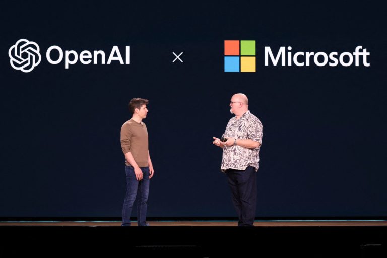 OpenAI CEO Sam Altman (L) speaks with Microsoft Chief Technology Officer and Executive VP of Artificial Intelligence Kevin Scott